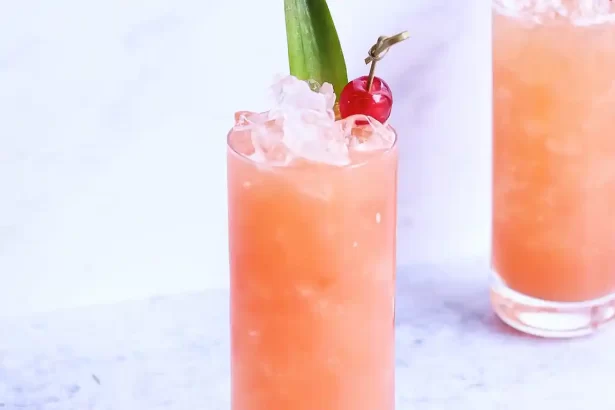A professionally crafted Manhattan cocktail with a cherry garnish