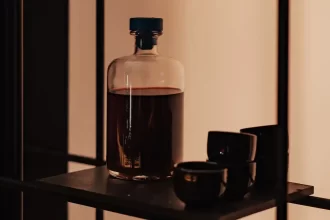 Kit wine making recipes - Bottles of homemade wine with winemaking equipment.