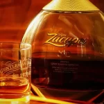 A bottle of Zacapa Rum with a glass