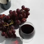 A variety of sweet wines displayed with different types of desserts.