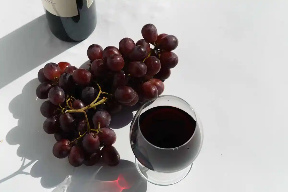 A variety of sweet wines displayed with different types of desserts.